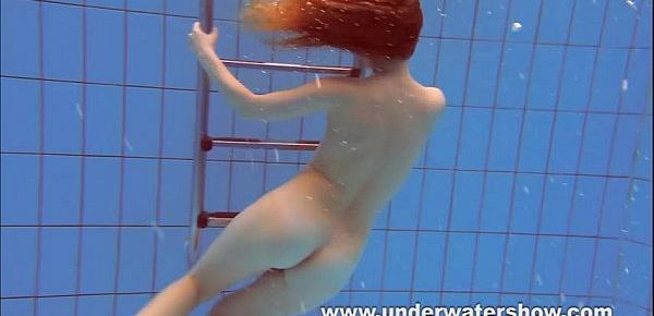  Redhead Katka playing underwater